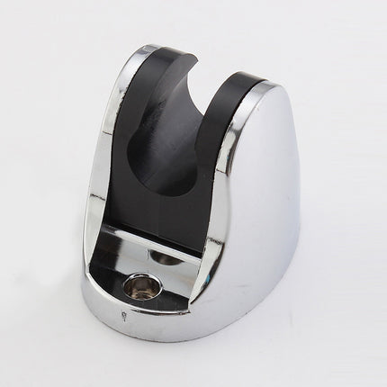 Metallic clip with black center on a white background