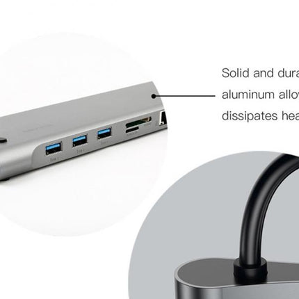 A silver aluminum hub or dock with multiple USB-A and USB-C ports, shown with callout text reading 'Solid and durable aluminum alloy dissipates heat fast' and a circular inset of a black cable attached.