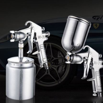 Two spray guns with a car in the background