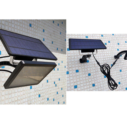 Solar-powered outdoor light fixture on a tiled wall.