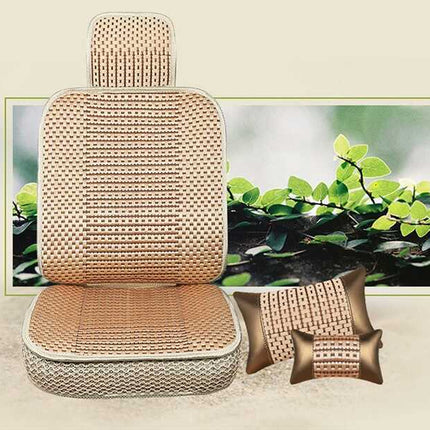 A beige and brown woven car seat cover set with a matching headrest and two matching lumbar pillows, displayed in front of a framed nature print on a light beige background.