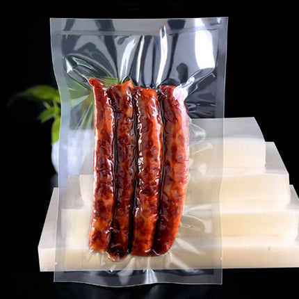 Vacuum-sealed package of sausages on a white platform with a black background