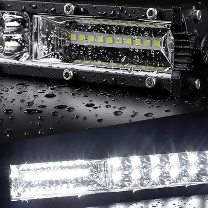 Close-up of LED light bar with water droplets on a dark surface
