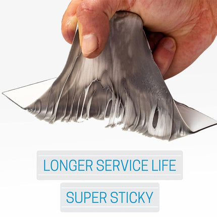 Hand holding a metallic shark fin with text 'Longer Service Life' and 'Super Sticky' on a white background