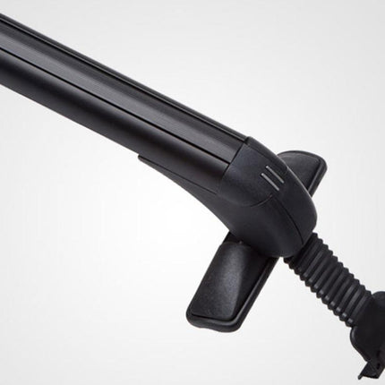 Close-up of a black metal roof rack bar with a mounting bracket and textured mounting sleeve, shown against a light gray gradient background.