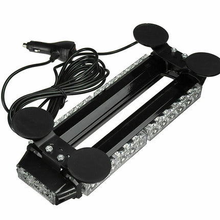 A black car windshield sun visor deflector with four circular suction cups and a car cigarette lighter power cable, shown on a white background.