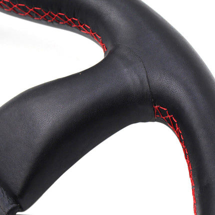 Black steering wheel with red stitching on a white background