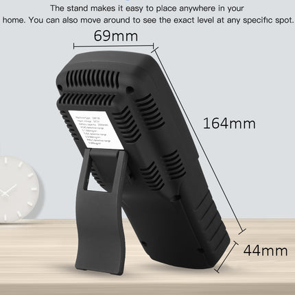 Black stand with measurements on a wooden surface