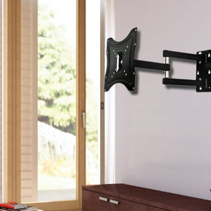 Black TV wall mount on a white wall with a window in the background