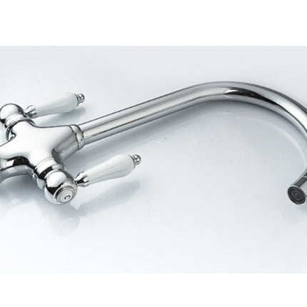 Chrome kitchen faucet on a white background