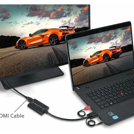Laptop connected to a monitor displaying a car on screen with HDMI cable.