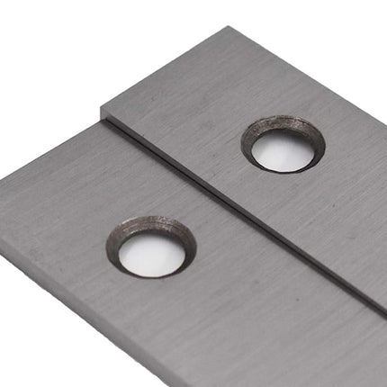 Metallic blade with two holes on a white background