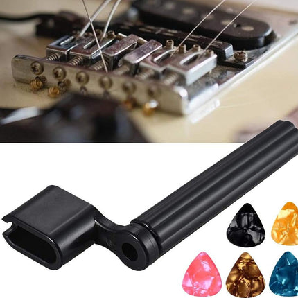 A black metal guitar bridge adjustment screwdriver shown on a white background, with a small inset photo at the top showing a guitar bridge and strings in use. Five triangle-shaped guitar pickups in pink, gold, black, and blue are displayed at the bottom right.