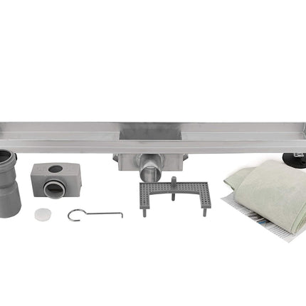 Stainless steel drain system with components on a white background