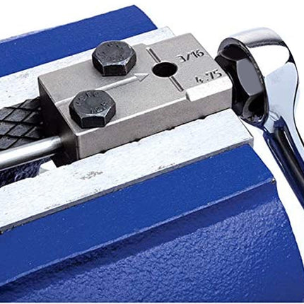 Metal tool with a wrench on a blue background