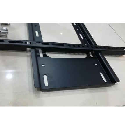 Black TV mount on a light gray surface