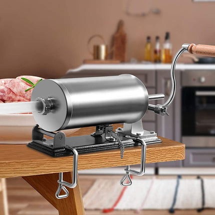 Manual meat grinder on a kitchen counter with a blurred kitchen background