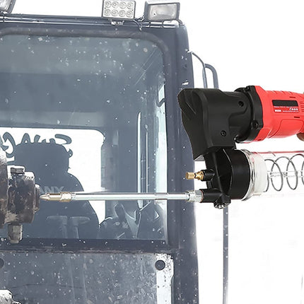 Person using a red and black power tool on a vehicle's window