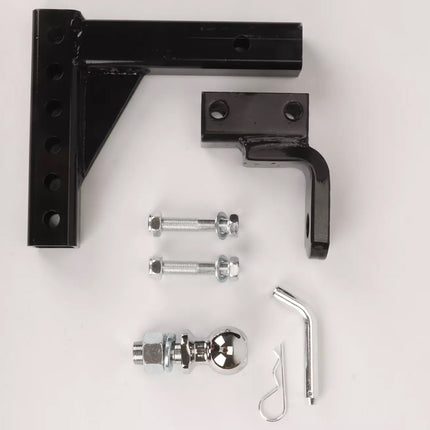 Black metal brackets with screws and a wrench on a white background