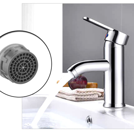 Chrome faucet with close-up of cartridge on a white background