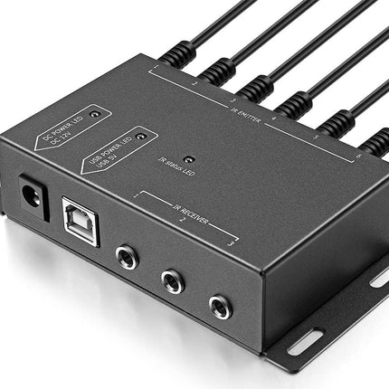 Black electronic module with multiple ports and cables on a white background