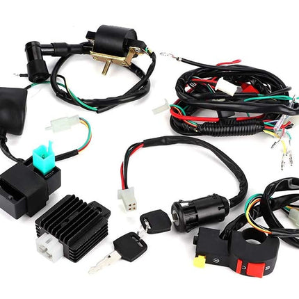 Motorcycle wiring harness kit with various components on a white background