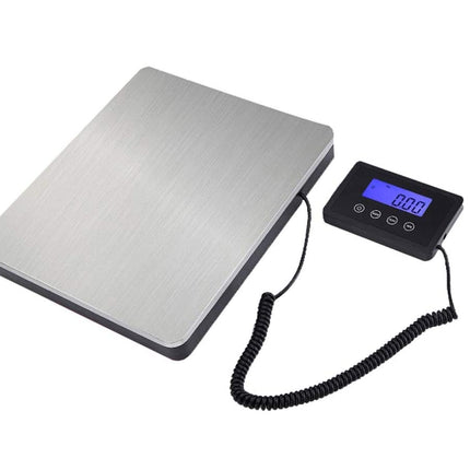 Digital scale with a metal platform and digital display on a white background