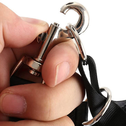 Hand holding a metal keychain with a hook on a white background