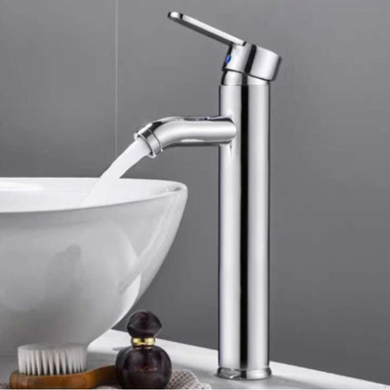 Chrome faucet with water flowing into a white sink against a gray background