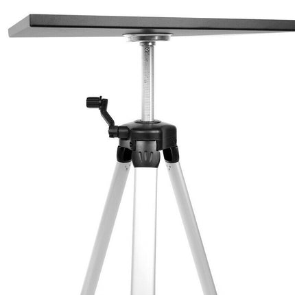Tripod with a small table on top against a white background