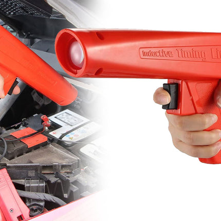 Red inductive timing light held by a person with car engine in the background