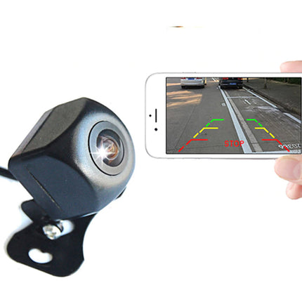 A black car backup camera with a mounting bracket shown next to a hand holding a smartphone displaying a rear-view road scene with colored distance guidelines.