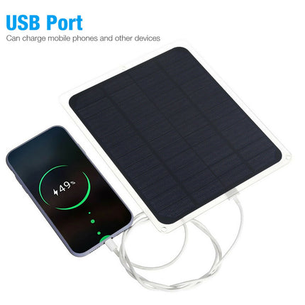 Solar panel with USB port charging a smartphone on a white background