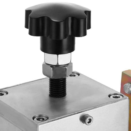 Mechanical component with a black knob on a white background