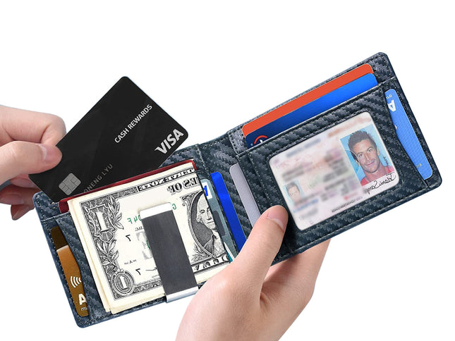 Person holding a wallet with various cards and money