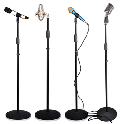 Four microphones on stands against a white background