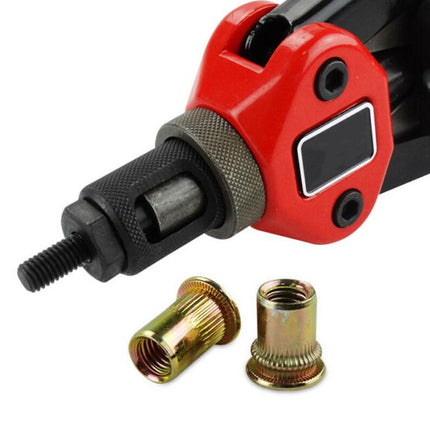 Red and black tool with two gold metal components on a white background