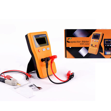 Orange capacitive meter with cables and accessories on a white background