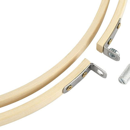 Wooden embroidery hoop with metal components on a white background