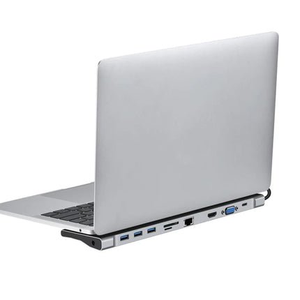 A silver aluminum laptop stand holding an open silver laptop, shown from a side angle against a plain white background.