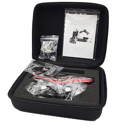 An open black zippered hard carrying case on a white background, containing a red-handled tool wrapped in clear plastic, small accessory bags, and a printed instruction sheet.