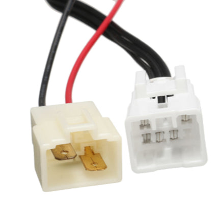 Two electrical connectors with black and red wires on a white background