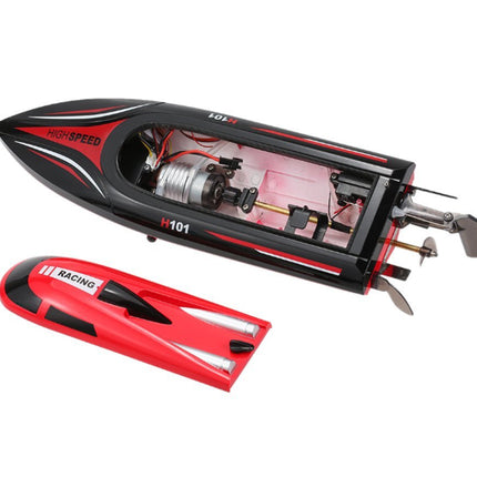 Black and red remote control boat on a white background