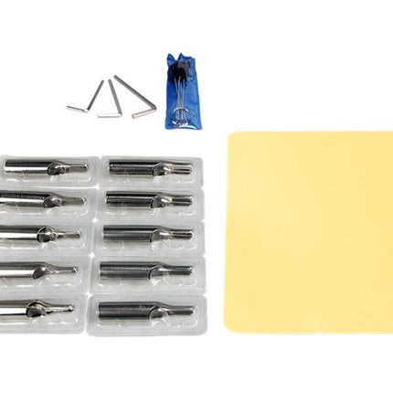 Set of drill bits in a clear plastic case with a yellow cloth on a white background