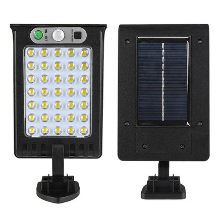 Solar-powered LED light fixture with solar panel on a white background