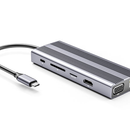 A silver aluminum USB-C hub with a ribbed top surface, featuring a built-in black USB-C cable, multiple card slots, a USB-A port, and an Ethernet port, shown on a white background.