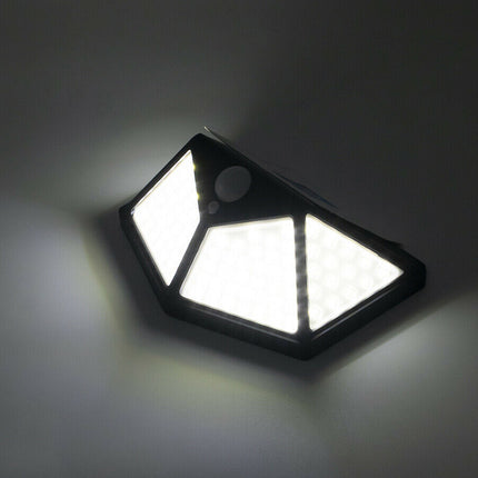 Solar-powered outdoor light on a dark background