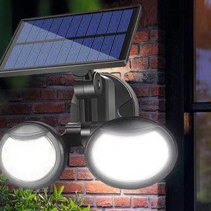 Solar-powered outdoor light fixture on a brick wall