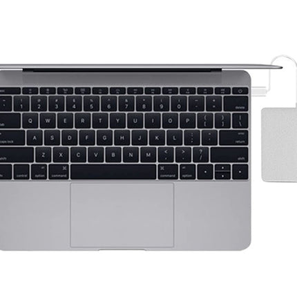 Laptop with a dock attached on a white background