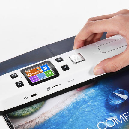 Hand interacting with a digital device on a magazine